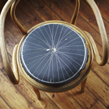 Natural cotton printed bike wheel cushion by Ella Doran